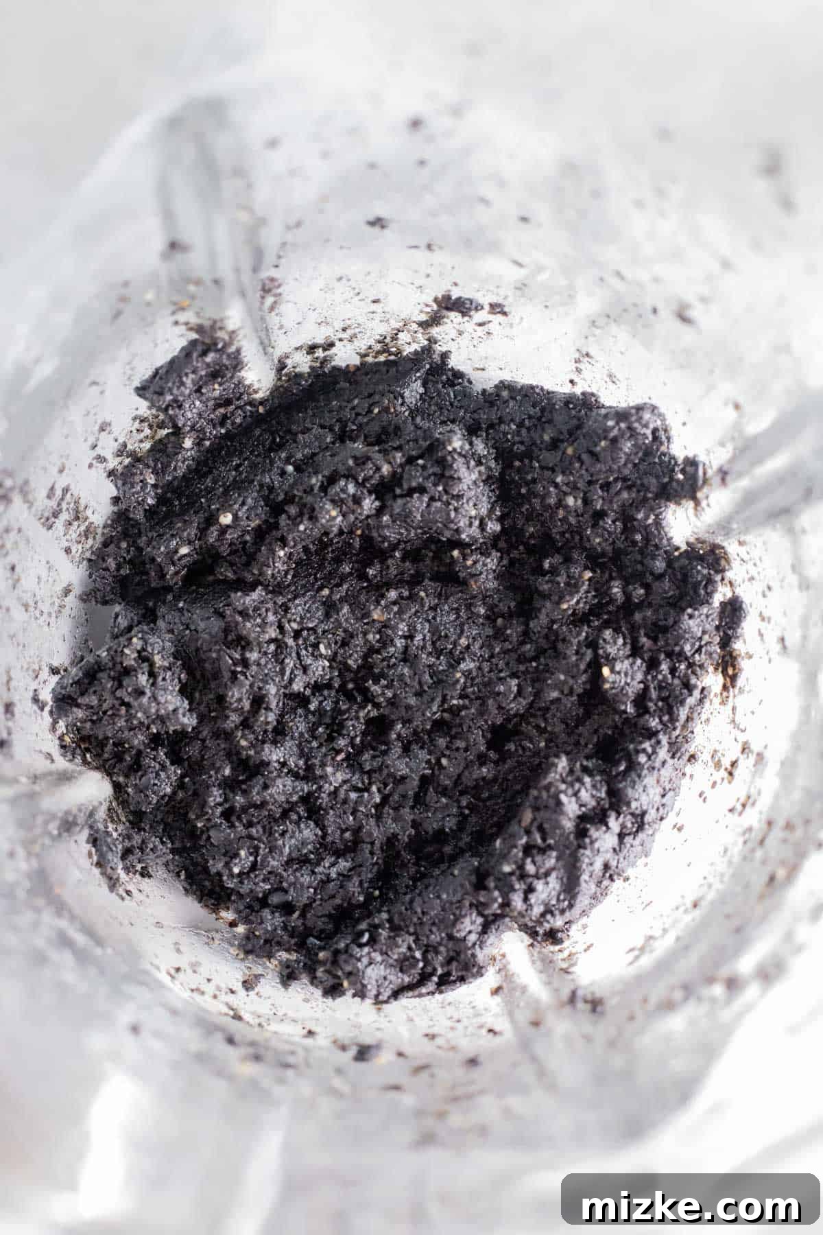 Midnight Sesame Dream 6 black sesame paste inside a glass blender jar