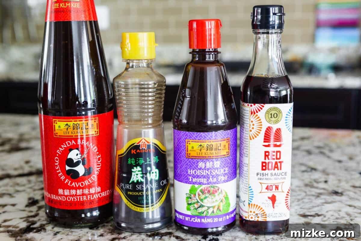 The Palette of Chinese Flavors 4 A collection of essential Asian sauces: oyster sauce, sesame oil, hoisin sauce, and fish sauce.