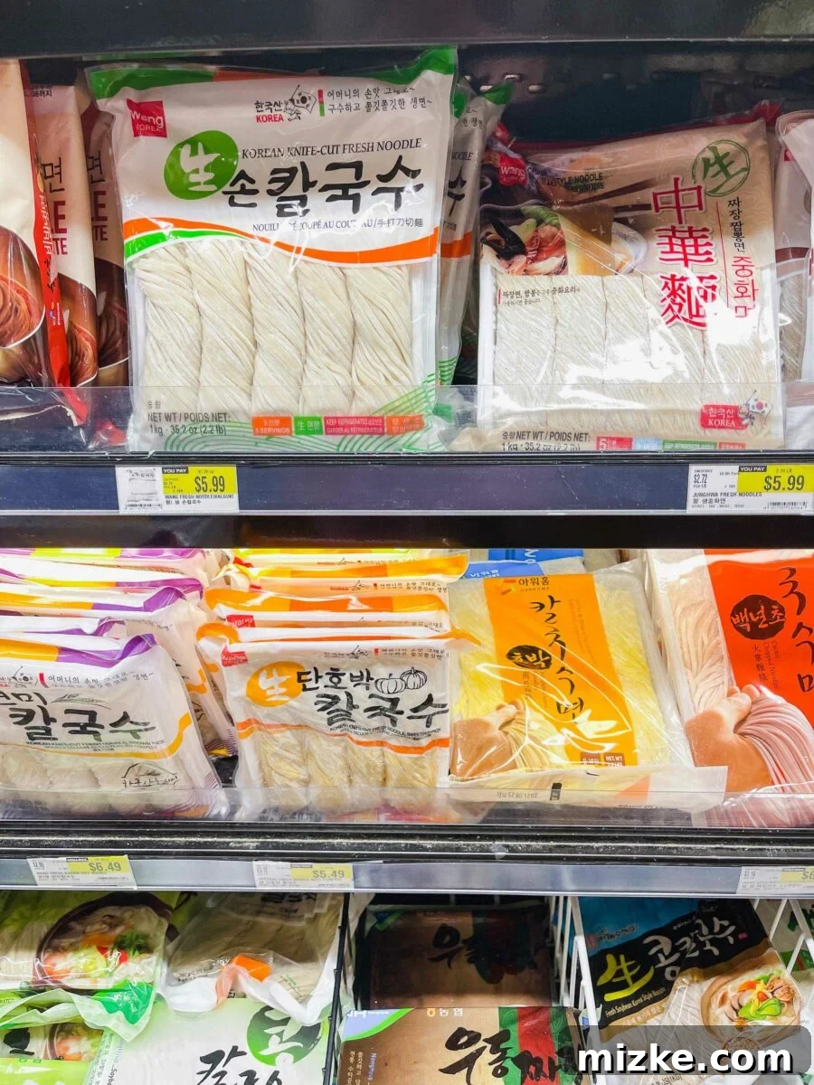 a photograph of the fresh noodles case at the asian grocery store