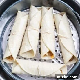 Crispy Air Fryer Beef Taquitos 18 uncooked beef taquitos in the air fryer basket