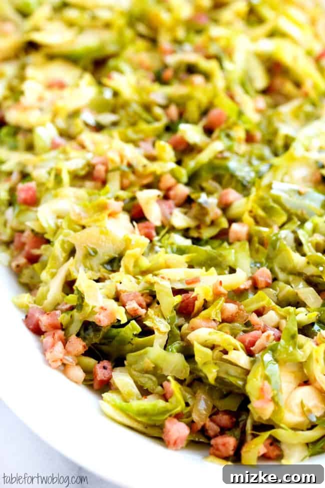 Crispy Pancetta Brussels Sprouts 3 Close-up of perfectly cooked shaved Brussels sprouts and pancetta on a plate