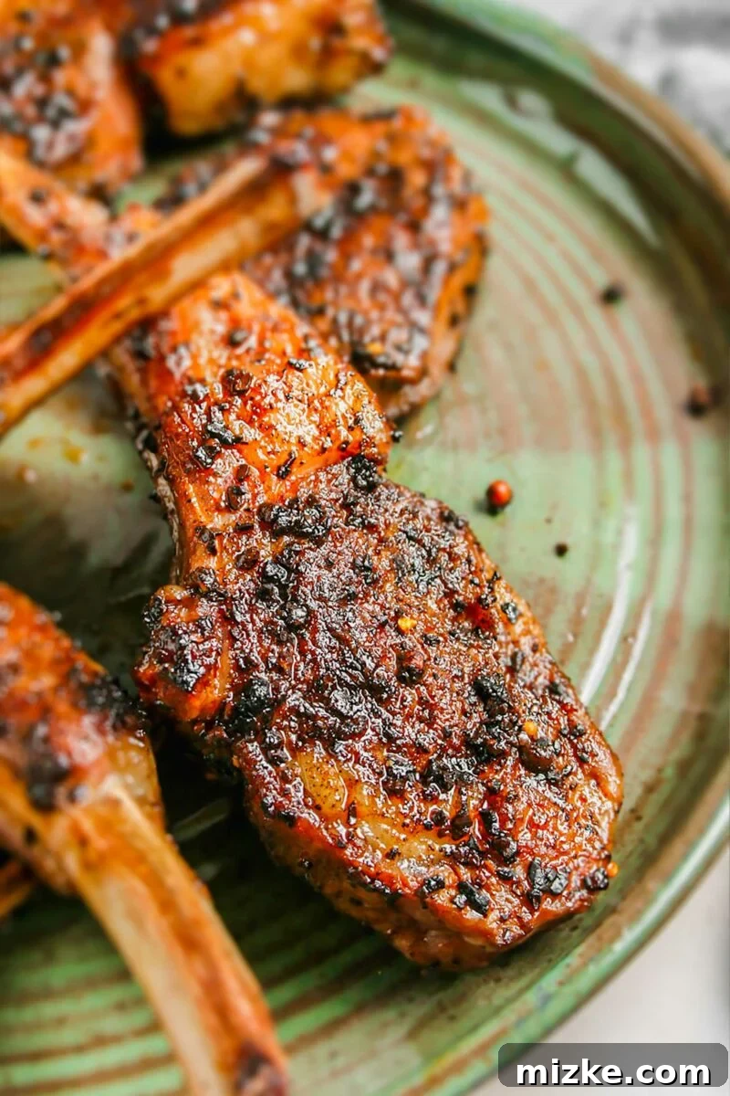 Smoky Coffee Rubbed Grilled Lamb Chops 5 Artfully arranged grilled lamb chops coated in coffee rub, served on a round, rustic green plate, ready for a gourmet dining experience.