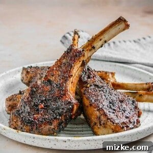 Smoky Coffee Rubbed Grilled Lamb Chops 6 Close-up of a succulent coffee rubbed grilled lamb chop, showcasing its perfect sear and rich color.