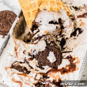 A scoop of Oreo ice cream in a cone, reflecting the delightful texture.