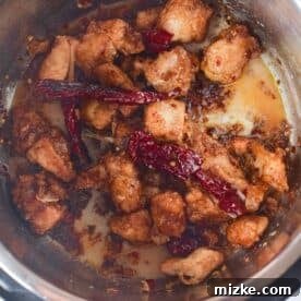 Chicken tossed in General Tso sauce in the Instant Pot