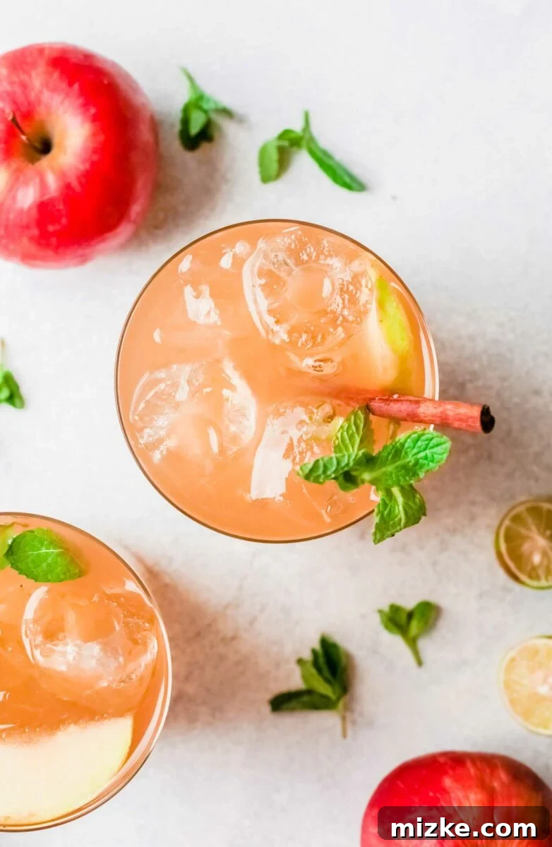 Crisp Apple Mojito 6 Ice cubes float at the top of a glass of mojito, emphasizing its refreshing nature.