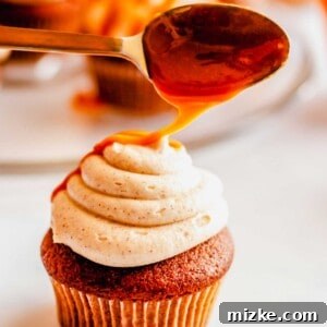 A perfectly frosted Apple Cider Cupcake, ready to be enjoyed.