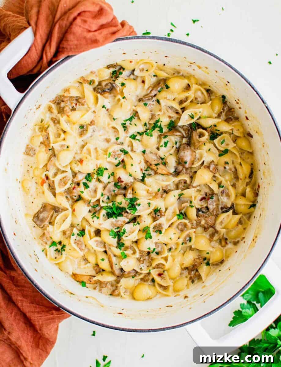 Baked Four Cheese Beef Stuffed Shells 2 A large white bowl is filled with cheesy beef pasta.