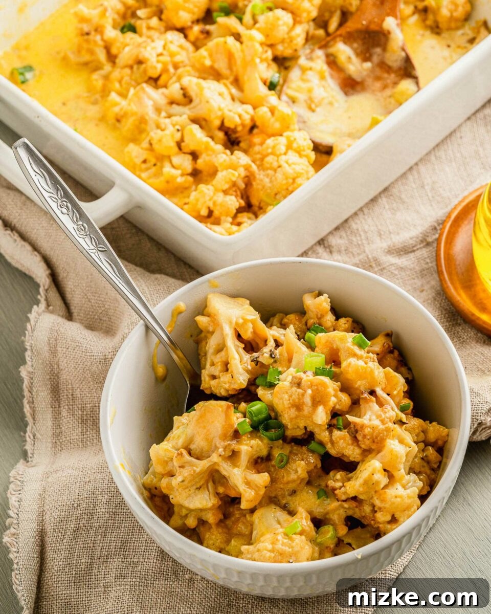 Golden Baked Cheesy Cauliflower Delight 6 A bowl is filled with a personal serving of cheesy cauliflower.