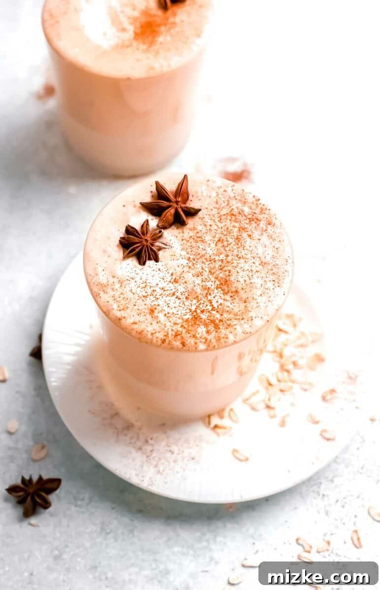 Autumn Pumpkin Bliss 2 A full glass of pumpkin pie smoothie is topped with cinnamon and two star anises.