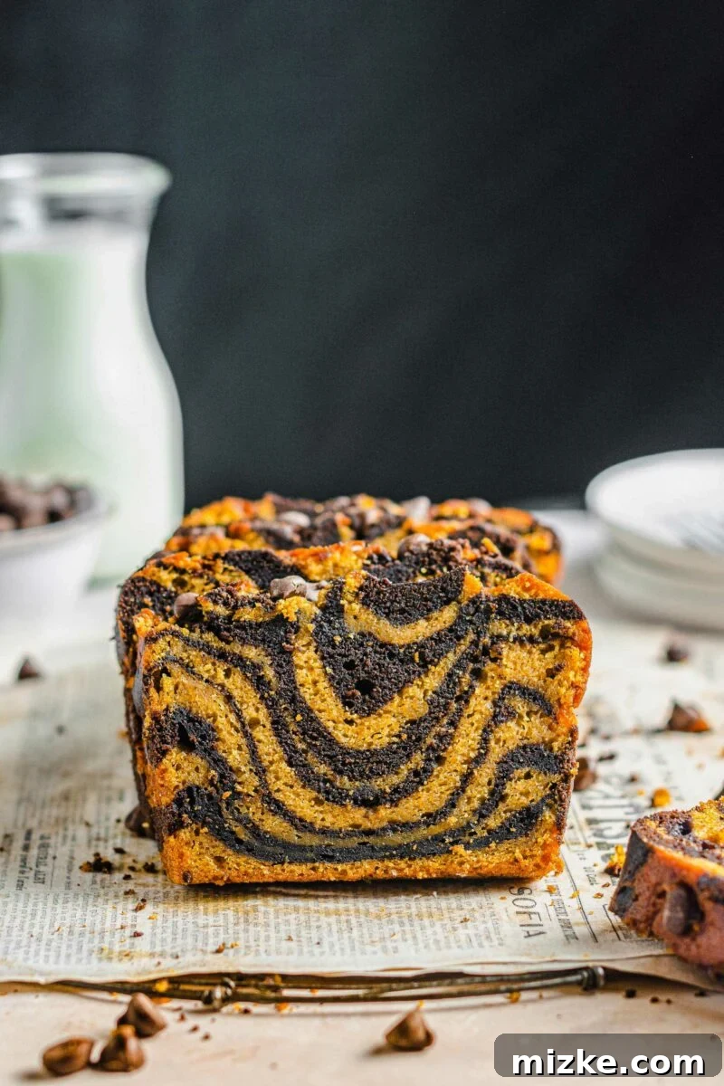 Pumpkin Chocolate Tiger Stripe Bread 2 Marbled bread has been sliced, revealing a swirled center.