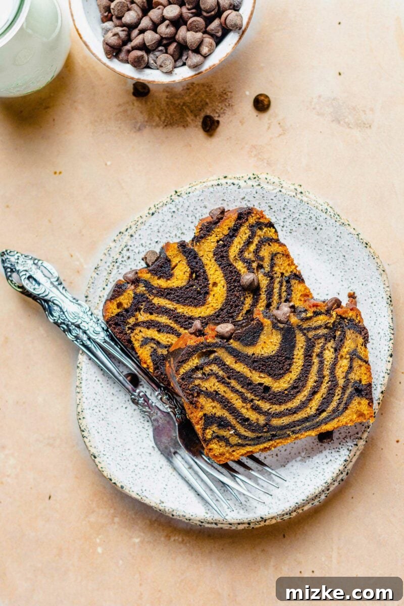 Pumpkin Chocolate Tiger Stripe Bread 5 Two forks are placed next to two pieces of pumpkin chocolate bread.