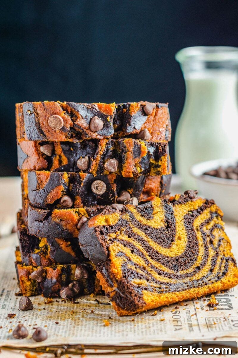 Pumpkin Chocolate Tiger Stripe Bread 6 A stack of bread slices is presented on newspapers.