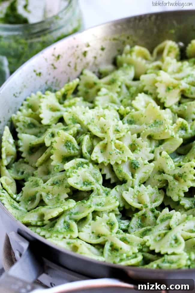 Peppery Arugula Pesto Farfalle with Creamy Goat Cheese 4 A bowl of fresh arugula pesto bowtie pasta ready to be served