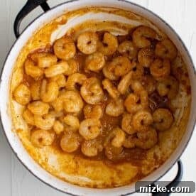 Spicy Cajun Shrimp Skillet Pasta 6 cajun-seasoned shrimp in a pan with sauce