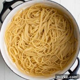 Spicy Cajun Shrimp Skillet Pasta 7 cooked linguine noodles in a pot