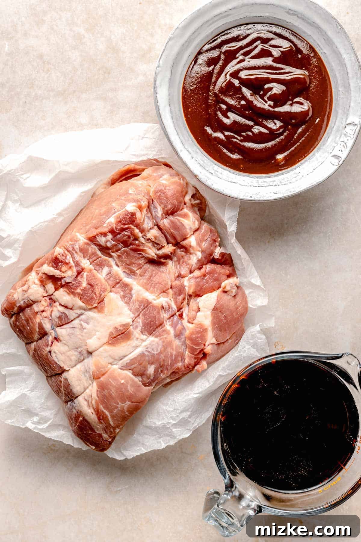 Four simple ingredients for creating delicious slow-cooked pulled pork sliders. Essential ingredients laid out for making pulled pork sliders: pork, soda, BBQ sauce, and slider buns.