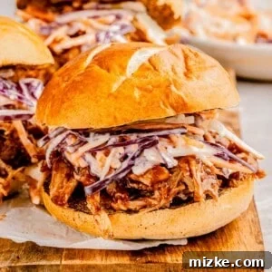 Tender Slow Cooker BBQ Pork Sliders 2 BBQ pulled pork sliders with slaw.