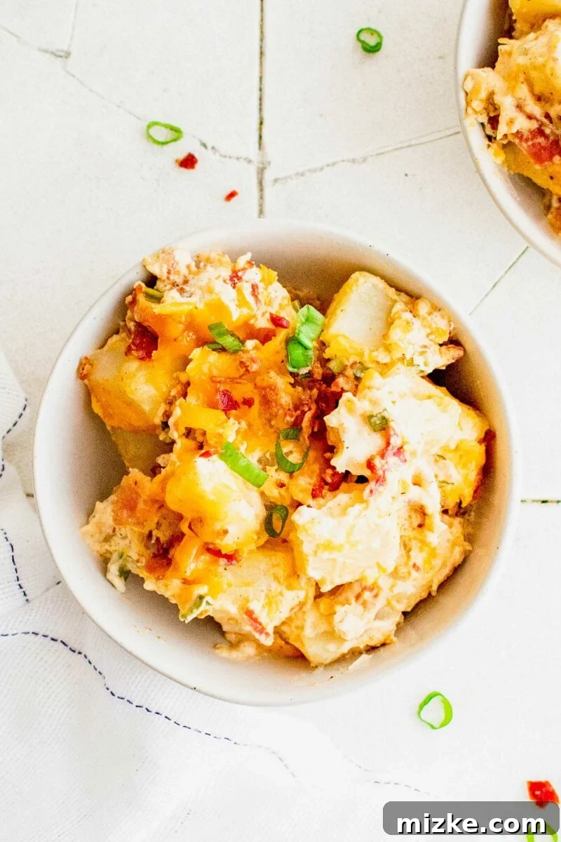 Loaded Potato Dream Bake 6 A small white bowl is filled with a serving of potato casserole.
