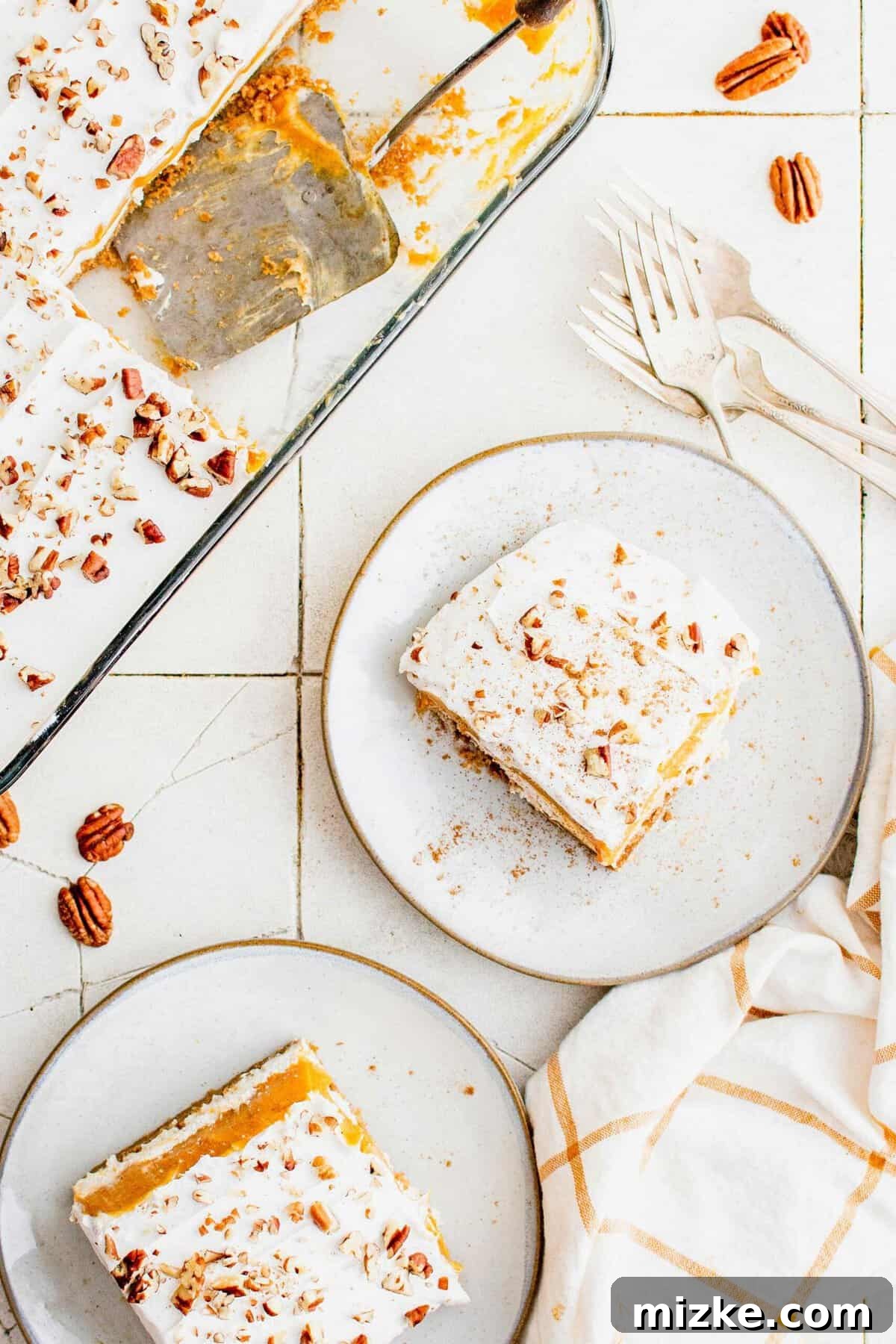 Serve up these gorgeous layers of fall flavor with Pumpkin Delight. Two plates contain servings of pumpkin delight.