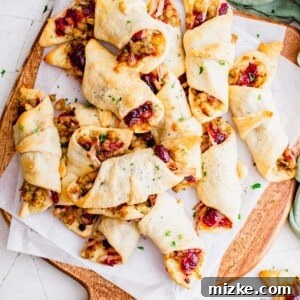 Thanksgiving in a Blanket rolls on a white parchment paper.