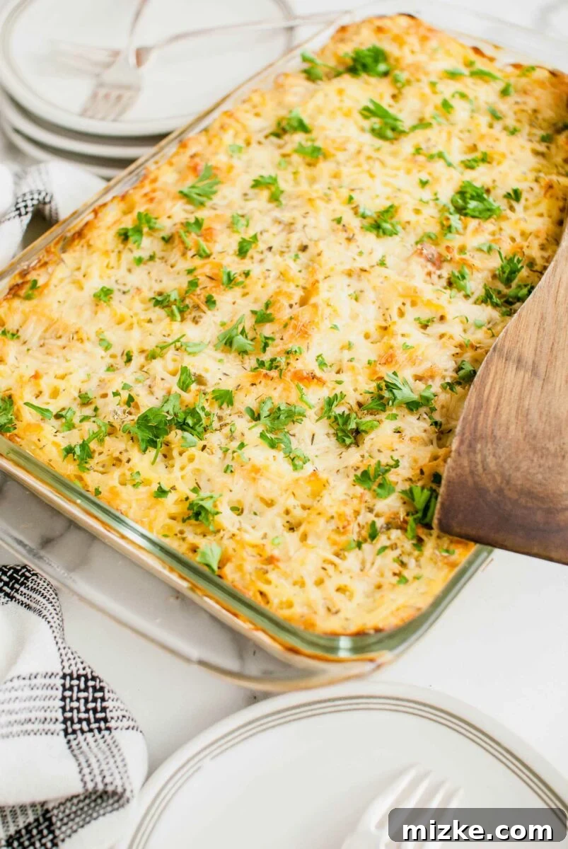 Creamy Turkey Tetrazzini 2 A beautifully baked casserole dish of golden brown Turkey Tetrazzini, ready to be served.