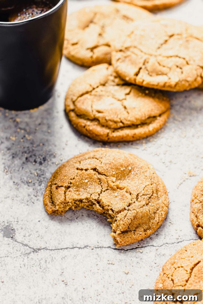 Warm Cinnamon Brown Sugar Delights 5 Several cookies are placed next to a mug filled with black coffee.