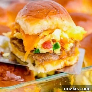 Breakfast slider being lifted out of baking dish