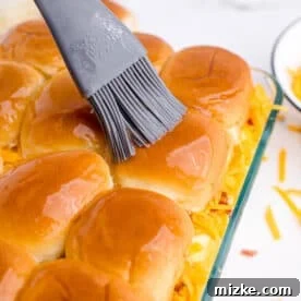 Butter spread on top of slider buns with a silicone brush