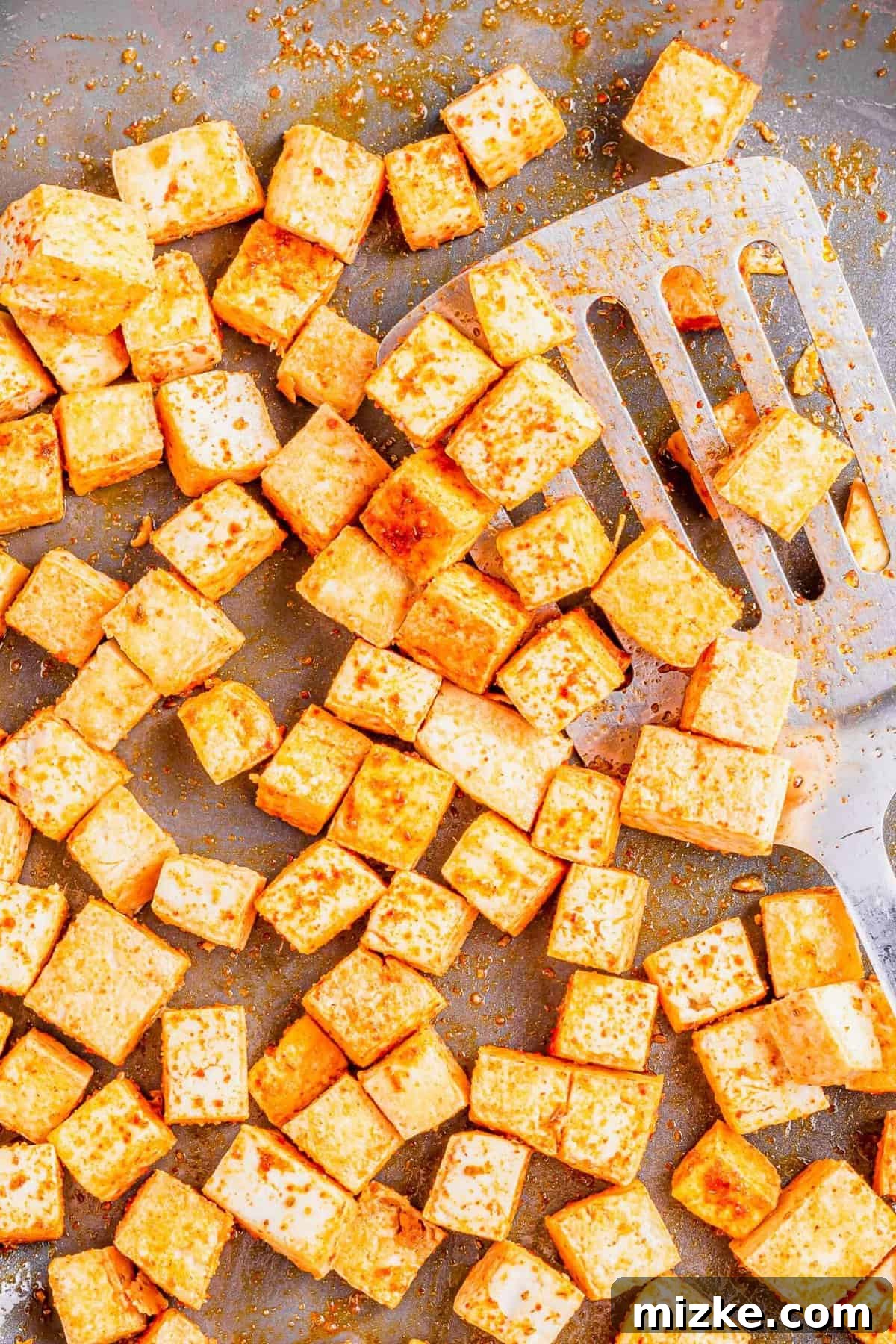 Streetwise Tofu Tacos 4 Seasoned tofu cubes with metal spatula