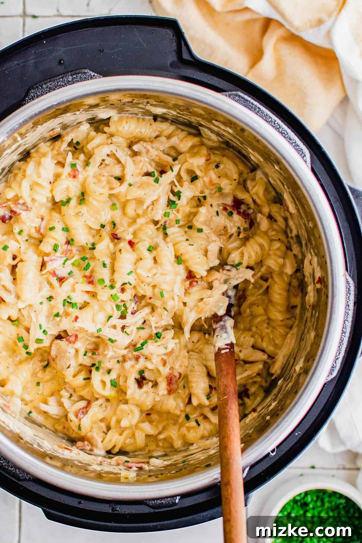 Overhead view of cheesy chicken pasta in Instant Pot