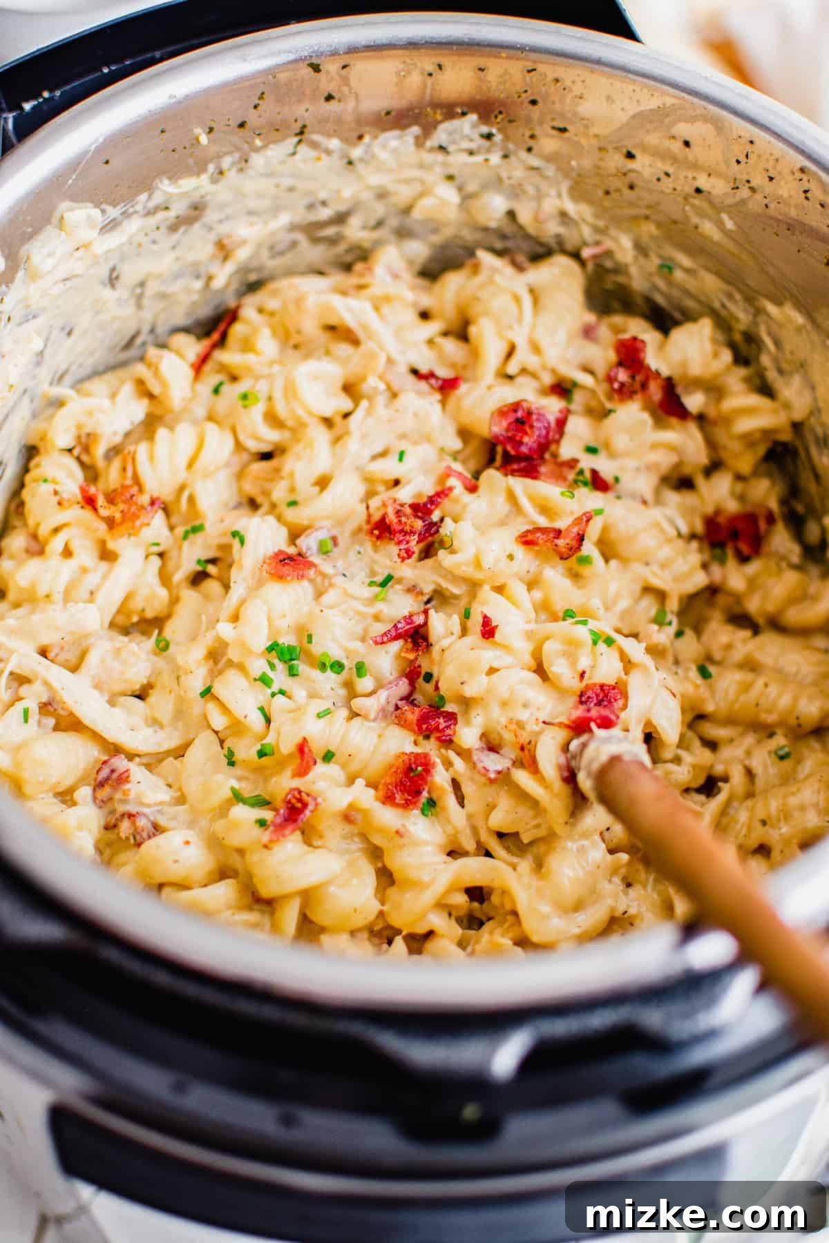 Overhead view of creamy chicken pasta in Instant Pot
