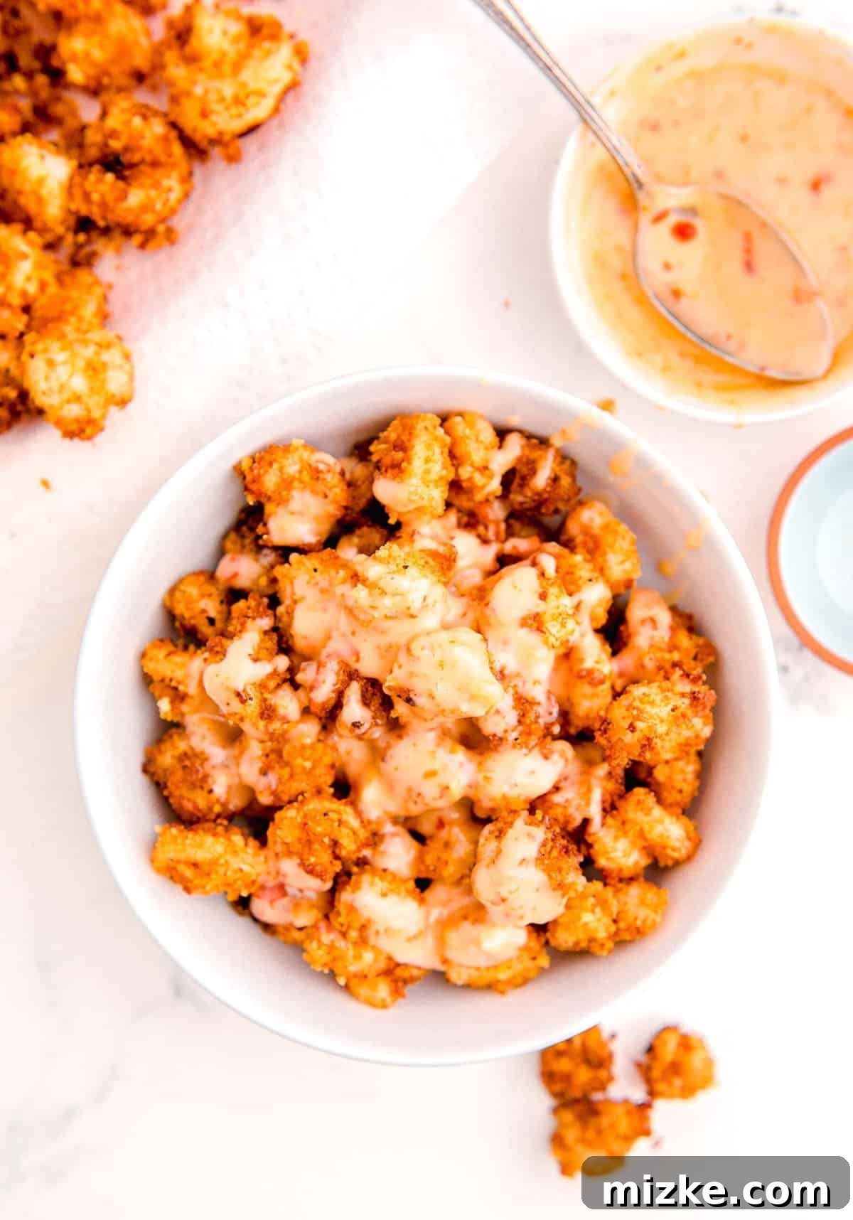 Dynamite Shrimp 12 the mayo mixture is added on top of the bowl with the fried shrimp