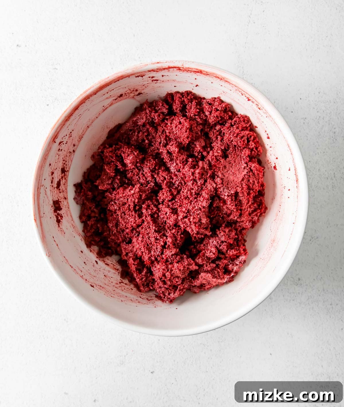 Velvet Cake Bliss Bites 3 Finely crumbled red velvet cake mix ready for frosting in a white bowl.