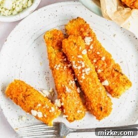 Crispy Buffalo Tofu fries on plate with fork