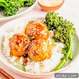 Bowl of rice topped with 3 teriyaki tofu meatballs and spears of steamed broccoli