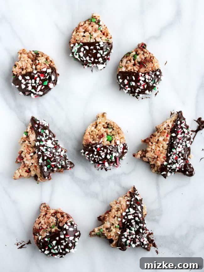 Festive Krispie Delights 2 Freshly made Holiday Rice Krispie Treats cut into festive shapes.