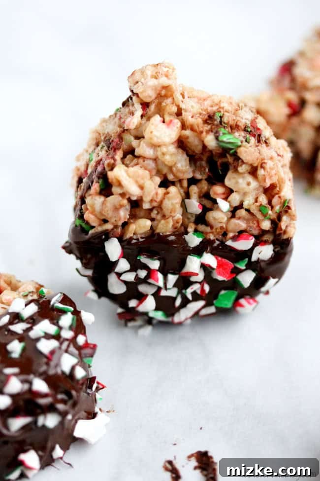 Festive Krispie Delights 3 Close-up of Holiday Rice Krispie Treats, showing their chewy texture.