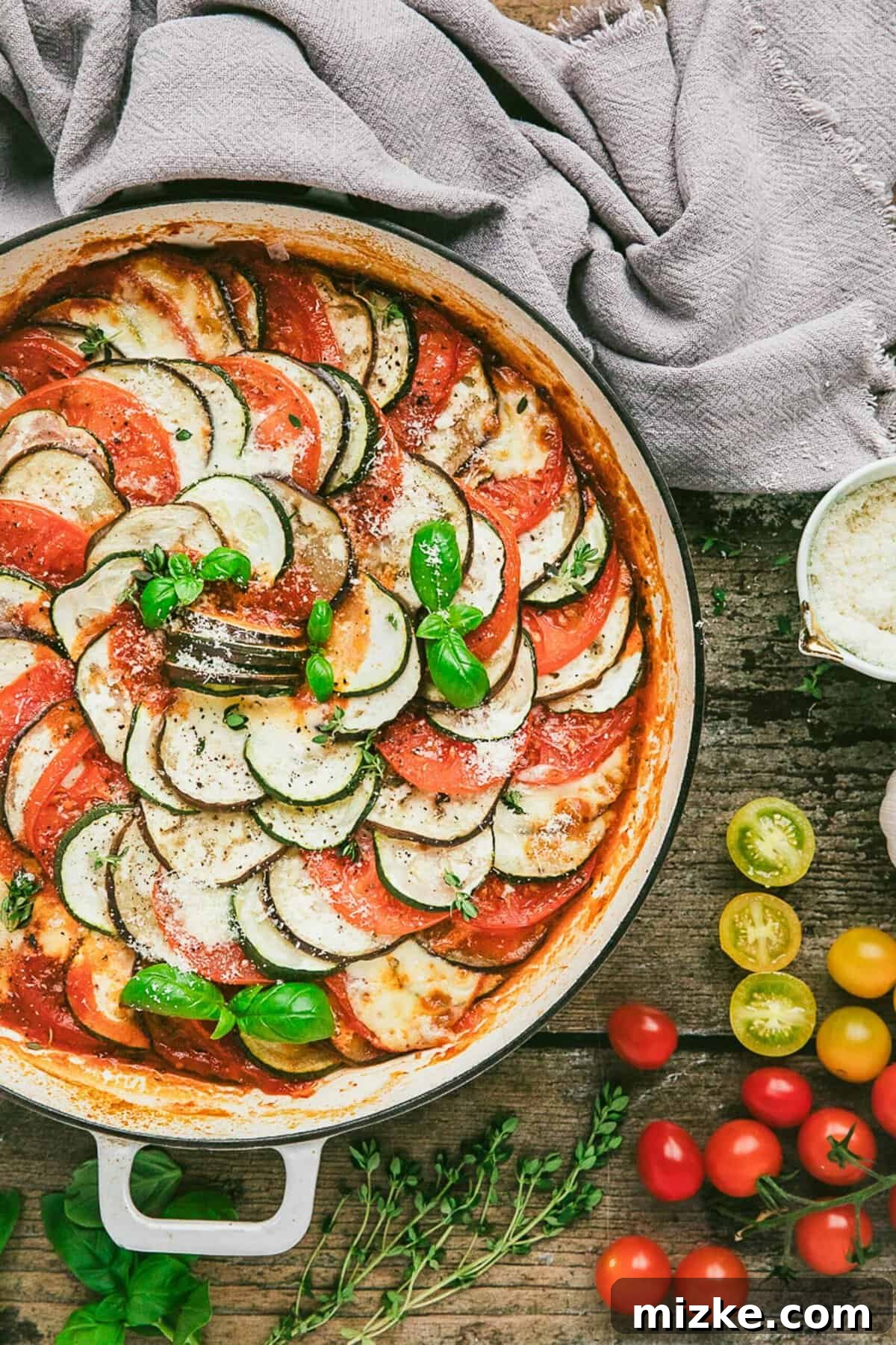 Overhead view of ratatouille in baking dish, showing layered vegetables