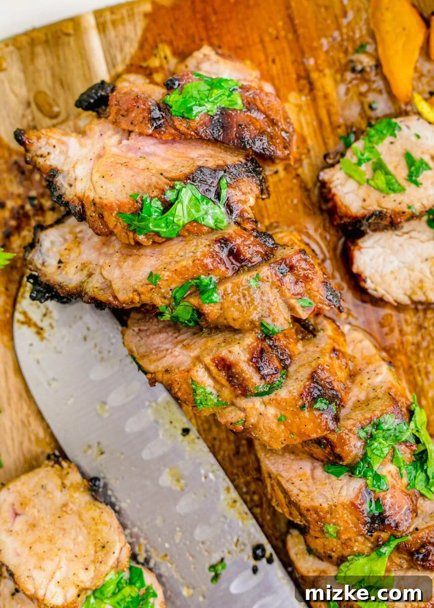 Succulent Grilled Pork Medallions 3 Fresh herbs garnish slices of grilled pork tenderloin.