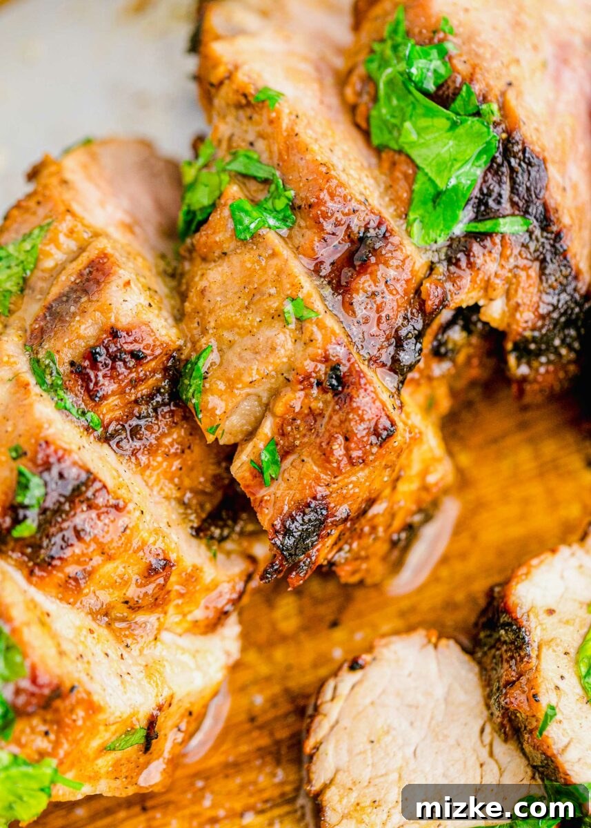 Succulent Grilled Pork Medallions 6 Grilled pork tenderloin is slightly charred on the outside and cooked through on the inside.