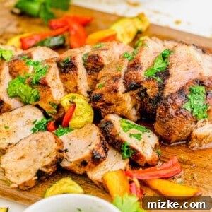 Grilled Pork Tenderloin slices with herbs.