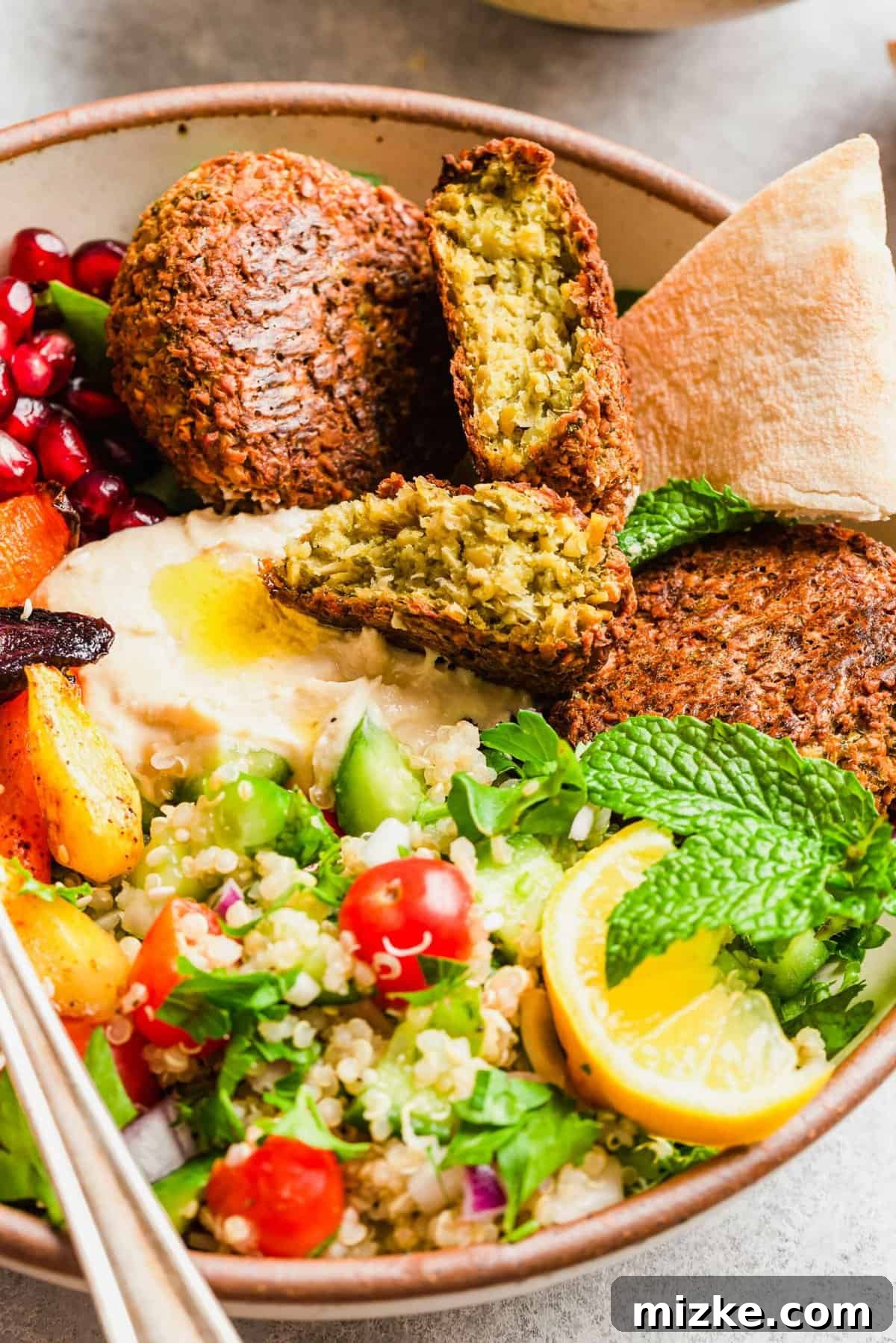 Falafel Harvest Bowl 3 Closeup shot of a Falafel Buddha bowl showcasing the vibrant colors and textures