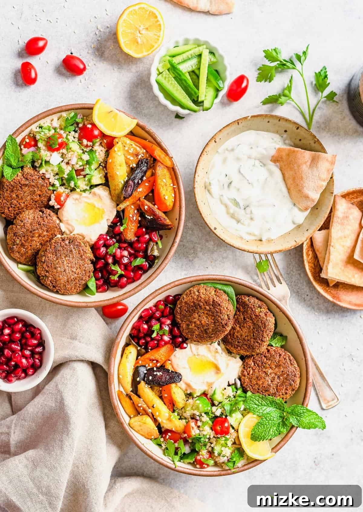 Falafel Harvest Bowl 6 Overhead view of two beautifully prepared Falafel Buddha bowls, perfect for sharing