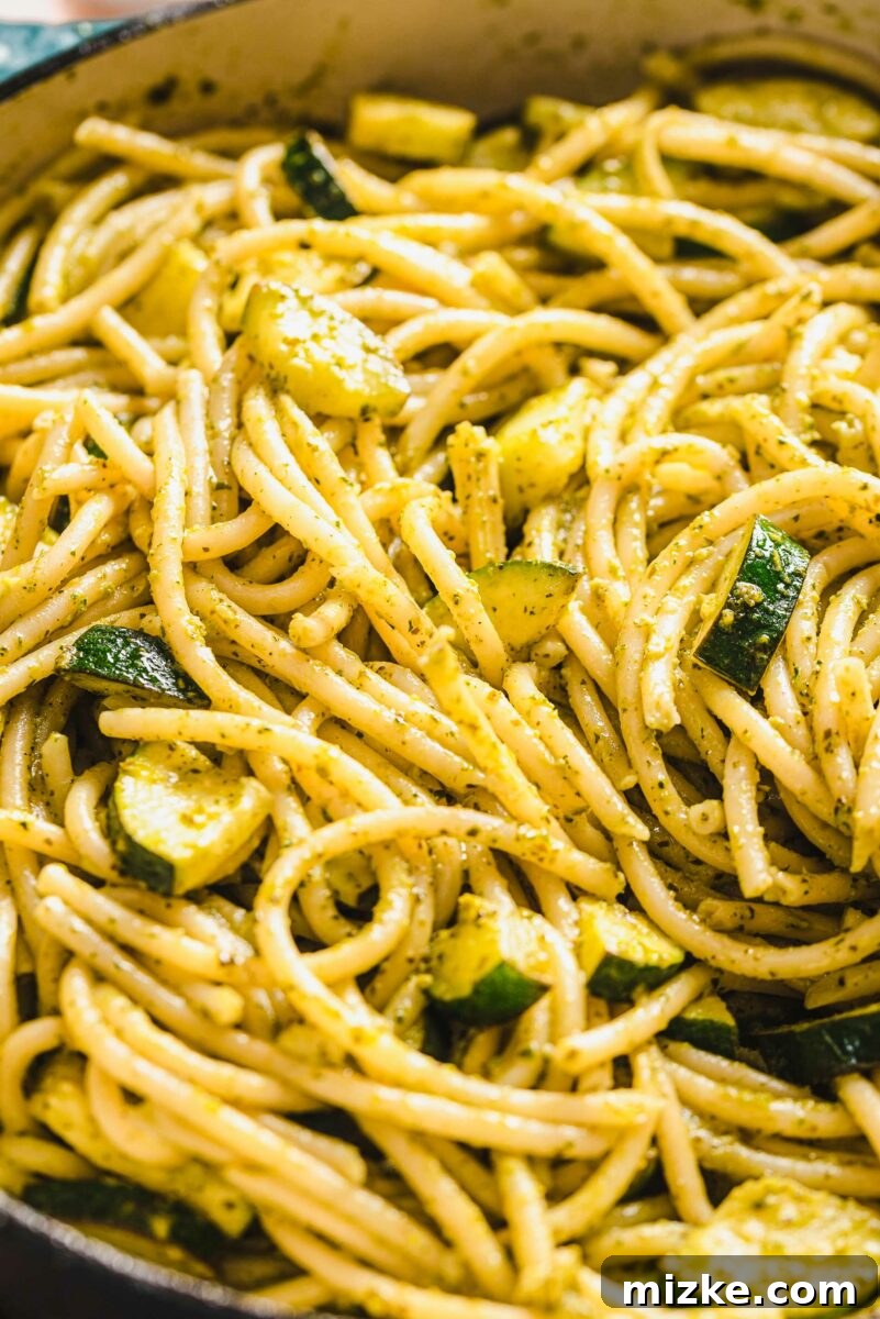 Velvety Lemon Zucchini Pasta 3 Close-up of chopped zucchini pieces generously mixed throughout the creamy pasta dish.