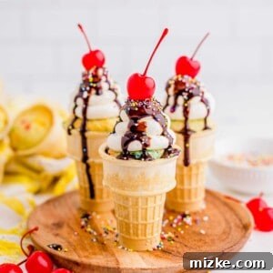 Three ice cream cone cupcakes are placed on a wooden serving plate.