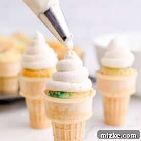 a swirl of buttercream is piped onto ice cream cone cupcakes