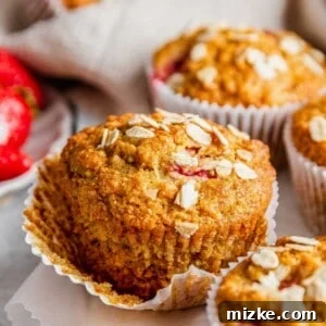 Strawberry oatmeal breakfast muffin with loosened wrapper