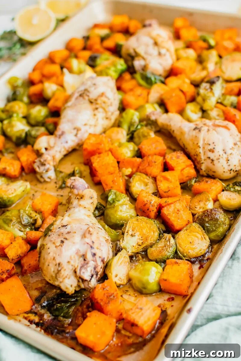 Zesty Golden Drumsticks 3 baked lemon pepper chicken legs and vegetables on a sheet pan