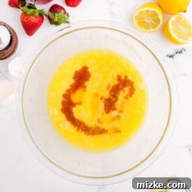 Vanilla extract and eggs are added to the sugar and butter mixture